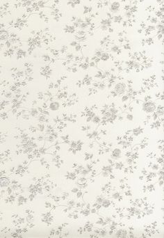 a white and grey floral wallpaper with small flowers on the back half of it