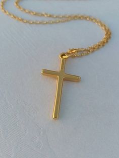 A nice, dainty 14k gold filled necklace with an eye catching plain cross. A dainty Christian necklace that protects the person wearing it. A nice gift for her Length approx. 15 inches / 38 cm - with 1.2 inch extension. ♥ All items will come in a nice gift box ♥ ★ Read our policies before purchase: https://www.etsy.com/shop/Jewellusion/policy/ ★ Convo me for custom orders or any questions you might have ♥ Visit our shop for more fabulous jewels: https://www.etsy.com/shop/Jewellusion/ μ ♥ Follow m 14k Gold Filled Cross Pendant Necklace As Gift, 14k Gold Filled Cross Necklace Gift, Everyday Cross Charm Necklace With Adjustable Chain, Gold Cross Necklace With Delicate Chain For Everyday, Everyday Gold Cross Necklace With Delicate Chain, Everyday Cross Charm Necklace With Clavicle Chain, Everyday Cross Necklace With Clavicle Chain, Gold Cross Necklace For Everyday, Gold Minimalist Personalized Cross Necklace