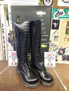 An amazing find for you. These boots have stood the test of time in their quality and style. These are authentically Made in England Dr Martens boots from the 1990s. This is regarded as their Golden Era because of the quality of products that were produced. These are an amazing Black Croc Print leather upper. Very strong and beautifully finished.  These have 20 holes and a cushioned sole that has a heel for those who wish that extra height.  These are a UK size 4, European 37, ladies USA 6. Knee-high Grunge Boots For Streetwear, Grunge Knee-high Boots For Streetwear, Vintage Black Boots With Reinforced Heel, Retro Black Boots For Streetwear, Fitted Lace-up Streetwear Boots, Retro Winter Boots For Streetwear, Vintage Boots For Winter Streetwear, Retro Round Toe Boots For Streetwear, Dr Martens Boots