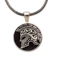 A circular pendant hangs from a chain featuring the image of a warrior's helmet. Handcrafted from sterling silver this men's pendant necklace is designed by Indonesia's Putu Gede Darmawan who draws inspiration from Hayam Wuruk known as the fourth king of the ancient Javanese kingdom of Majapahit. Mens Pendant Necklace Silver, Collectible Round Pendant Box Chain Jewelry, Viking Style Engraved Sterling Silver Jewelry, Collectible Viking Sterling Silver Jewelry, Viking Style Sterling Silver Round Pendant Jewelry, Viking Style Sterling Silver Pendant, Viking Style Sterling Silver Pendant Jewelry, Viking Sterling Silver Pendant Jewelry, Viking Style Engraved Round Pendant Necklace