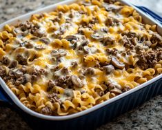 a casserole dish filled with pasta and ground beef