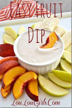 an easy fruit dip with sliced peaches and apples on a white platter, ready to be eaten