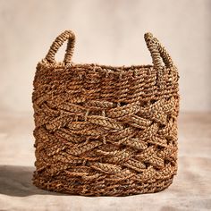 a woven basket sitting on top of a table