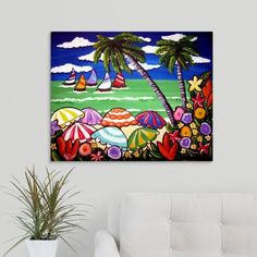 a living room with a white couch and painting on the wall above it is a palm tree