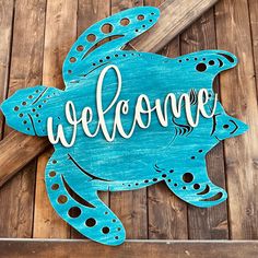 Say howdy to your visitors with this beachy-chic turtle door hanger! Show everyone you've got style and personality (and maybe a bit of attitude!) with this cutie-pie greeting at your entrance. Make an entrance they won't forget - it's a welcome they can she'lll-o to! Beach Door Sign, Ocean Door Hanger, Turtle Welcome Sign, Painted Sea Turtles On Wood, Welcome Beach Signs Wooden, Turtle Silhouette, Sea Sign, Ocean Bathroom, Driftwood Frame