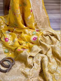 Update! - Zynah covered by LBB - https://lbb.in/bangalore/zynah-designs-handloom-sarees/ Banarasi pure georgette woven saree, decorated with intricate design. Their special characteristics are Mughal inspired designs such as intricate interwining floral and foliate motifs. Other features are gold/Silver work, compact weaving, figures with small details, metallic visual effects, pallus, jal (a net like pattern). Depending on the intricacy of its designs and patterns, a saree can take from 15 days Benares Georgette Sarees, Yellow Art Silk Anarkali Set With Chikankari Embroidery, Semi-stitched Bollywood Blouse Piece In Jamawar, Semi-stitched Banarasi Silk Blouse Piece With Pallu, Semi-stitched Banarasi Silk Blouse With Chikankari Embroidery, Yellow Art Silk Sharara With Chikankari Embroidery, Yellow Sharara With Chikankari Embroidery In Art Silk, Yellow Chikankari Embroidery Sharara In Art Silk, Bollywood Banarasi Silk Saree With Chikankari Embroidery