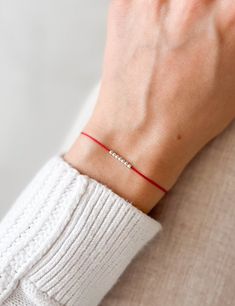 Minimalist Silk Wish Bracelet With Chosen Number Of Beads Make a wish and put this bracelet on your wrist. Wear this minimalist red string bracelet as a symbol of protection and good fortune. The Red String is an ancient Kabbalah tradition believed to ward off negative energy and provide a powerful layer of protection against the evil eye. Details: ✦ 2mm delicate beads ✦ Natural waterproof silk cord in red ✦ Adjustable bead so it fits perfectly on your wrist ✦ Beautifully packaged, ready for gif Simple Bracelets With Sliding Knot For Gift, Minimalist Beaded Friendship Bracelets, Minimalist Friendship Bracelet For Best Friend, Minimalist Bracelet With Sliding Knot For Best Friend, Simple Bracelets With Sliding Knot As Gift, Minimalist Sliding Knot Bracelet For Best Friend, Minimalist Resizable Beaded Bracelets As A Gift, Minimalist Friendship Bracelet For Best Friend Gift, Minimalist Resizable Beaded Bracelets