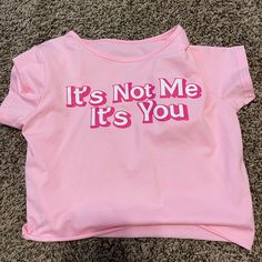 “It’s Not Me It’s You” Pink Baby Tee. Never Worn Graphic Baby Tees Aesthetic, Fitted Pink Tops With Funny Text, Spring Streetwear Tops With Funny Text, Fun Logo Print Summer Tops, Pink Slogan Tops Y2k Style, Y2k Pink Slogan Tops, Cute Pink Tops With Funny Text, Cute Logo Print Tops For Spring, Pink Tops With Funny Text