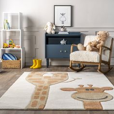 a child's room with a rocking chair, teddy bear and bookshelf