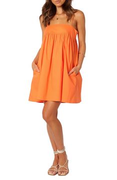 Cotton poplin in a summery shade adds sunshine-ready style to this shift dress popped with handy pockets at the sides. Slips on over head Square neck Adjustable straps Side-seam pockets Unlined 100% cotton Hand wash, line dry Imported Orange Gameday Outfit, Light Orange Dress, Auburn Gameday Outfit, Orange Sun Dress, Auburn Gameday, Cruise Fits, Orange Summer Dress, Created Colorful, Petal And Pup