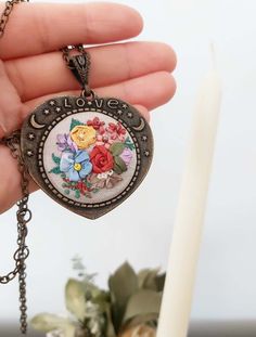 Rainbow necklace with floral embroidered heart design pendant -  long chain necklace - vintagestyle - love lettering necklace The embroidered part of the pendant measures  diameter 3.5 cm. The chain is about 62 cm. I use fine ribbon and dmc threads. Vintage Charm Necklace For Mother's Day, Vintage Charm Heart Pendant Necklace For Mother's Day, Mother's Day Heart Pendant Necklace With Vintage Charm, Mother's Day Vintage Charm Heart Pendant Necklace, Vintage Flower Charm Necklace For Gift, Flower Shaped Necklace With Vintage Charm As Gift, Flower Shaped Necklace With Vintage Charm For Gift, Vintage Heart-shaped Necklace For Gift, Vintage Heart Shaped Necklace For Gift