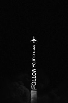 an airplane is flying in the sky at night with text below it that reads follow your dreams