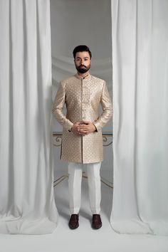 Elevate your formal attire with our Beige Prince Coat. Made from pure atlas material, this coat boasts a luxurious pure silk lining, perfect for any special occasion. The included raw silk kurta pajama and shawl, featuring embroidered borders, complete the elegant look. 4-Piece Suit Elegant Semi-formal Sets For Eid, Designer Straight Kurta Bandhgala For Ceremonial Occasions, Designer Ceremonial Bandhgala With Straight Kurta, Formal Festive Bandhgala With Resham Embroidery, Designer Long Sleeve Bandhgala For Formal Events, Designer Long Sleeve Bandhgala For Formal Occasions, Formal Bandhgala With Resham Embroidery For Festive Occasions, Fitted Silk Nehru Jacket Straight Kurta, Festive Formal Nehru Jacket With Intricate Embroidery