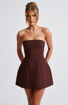 Simple and seriously chic, the Asha mini is this season's obsession. Perfect to wear for date nights, late nights and beyond, this strapless design is finished with seam details and a bubble shape skirt for extra volume. 



Colour: Brown.

Premium non-stretch crepe.

Fully lined.

Strapless.

Hugs the figure.

Seam details.

Bubble shape skirt.

Invisible zip fastening.

Mini length.

Model is an XS and is wearing an XS.

 Size: XS, S, M, L, XL, XXL Chic Brown Mini Dress, Dark Brown Mini Dress, Mini Brown Dress, Elegant Brown Strapless Mini Dress, Brown Off-shoulder Mini Dress For Date Night, Elegant Off-shoulder Brown Mini Dress, Evening Brown V-neck Mini Dress, Homecoming Dresses Corset, White Dress Spring