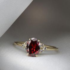 A strikingly beautiful Red Garnet ring surrounded by Six Diamonds.Flaunting a beautiful natural gemstone in a classic and elegant design to wear everyday.Handmade by artist in solid gold with an utmost attention to details.Beautifully finished with Each diamond and gemstone handpicked and inspected for the best color and depth.Get this ring today and enjoy it forever!Ring Features......................• Made to Order, perfectly finished, Fast shipping fully insured and traceable online.• Made in Hessonite Ring, Forever Ring, Garnet Ring Vintage, Brown Diamond Ring, Promise Rings Vintage, Timeless Engagement Ring, Garnet And Diamond Ring, Garnet Engagement Ring, Red Garnet Ring