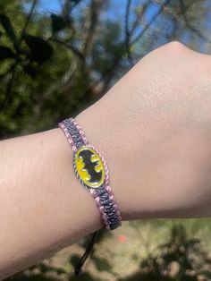 Set a fun tone for your relationship with these handmade Batman matching couples’ bracelets! Crafted with care, these accessories are perfect for couples who share a love for the Caped Crusader! Show your commitment to each other and your fandom with these unique Batman Neon Friendship Bracelets! #dynamicduo ☆ We work as quickly as possible to create your bracelets. However, since each order is handmade to order it can take 7-10 business days for your order to be shipped. (This does not include Handmade Themed Wristband For Gift, Handmade Themed Wristband Gift, Themed Handmade Wristband For Gift, Adjustable Fandom Bracelets As Gift, Customized Novelty Friendship Bracelets As Gift, Adjustable Novelty Jewelry For Friendship, Customized Themed Jewelry For Friendship, Handmade Themed Wristband, Themed Handmade Wristband