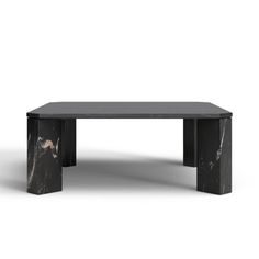 a black marble coffee table sitting on top of a white floor