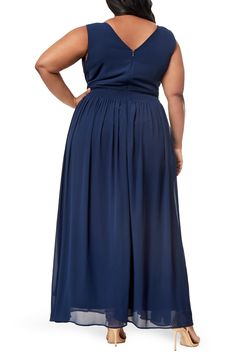 A flowy skirt and pleated bodice add graceful charm to this sleeveless maxi dress with an alluring V-neck. 60'' length (size 2X) V-neck Sleeveless Back zip closure 100% polyester shell/lining Machine wash Imported Model stats: 5'10" height, 41" bust, 36" waist, 48" hip. Model is wearing size 2X. Sleeveless Solid Maxi Dress With Pleated Bodice, Elegant Pleated Flowy Maxi Skirt, Bridesmaid Pleated Floor-length Maxi Dress, Flowy V-neck Chiffon Maxi Dress, Flowy Chiffon V-neck Maxi Dress, Flowy Chiffon Maxi Dress With V-neck, Long Dresses With Pleated Waist And Flowy Skirt, Dresses With Pleated Waist And Flowy Long Skirt, Ruched Flowy Maxi Dress