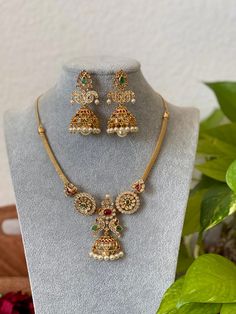 An elegant kemp attigai type necklace set for your local gatherings or parties. Height of the earrings: 6 Cm Width of the earrings: 2.8 cm Care Instruction : Avoid Heat & Chemicals Like Perfume, Deo, Alchol, Etc. | Clean With Dry Cotton Cloth | Pack In our Anti tarnish box after use. Gold Attigai Designs, Gold Necklace Without Locket Indian, Peacock Necklace Designs, Simple Temple Jewellery Necklace, Attigai Necklace Gold, Elegant Temple Necklace With Peacock Design As Gift, Antique Gold Jewelry Indian Necklaces, Elegant Round Temple Necklace With Peacock Design, Festive Elegant Peacock Temple Necklace