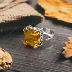 Citrine Ring  Stunning Citrine Ring,925 Sterling Silver Ring, Handmade Ring, Emerald Cut Ring, Solitaire Ring, Yellow Ring, Engagement Ring, Citrine Ring gemstone-12 mm gemstone (Heated) Why To Wear Silver As a metal, silver has significant health benefits that have been used across cultures for centuries. Silver has a proven track record as a powerful antimicrobial agent fighting infections and aiding in cold and flu prevention, wound healing, and more. Silver also helps with internal heat regulation and circulation. About gemstone- Citrine is associated with positivity and optimism, which is not surprising given its cheerful color. It's often used to assist in manifesting financial abundance and opportunities. It can also be used to awaken the solar plexus chakra, helping to cultivate co Yellow Crystal Ring For Promise, Yellow Open Ring Promise Ring, Yellow Open Ring For Promise, Yellow Open Promise Ring, Amber Topaz Ring In Sterling Silver For Promise, Citrine Crystal Promise Ring With Gemstone, Citrine Rings With Accent Stones For Promise, Citrine Crystal Promise Ring, Wedding Amber Topaz Ring In Sterling Silver