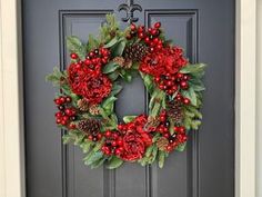 a christmas wreath is hanging on the front door