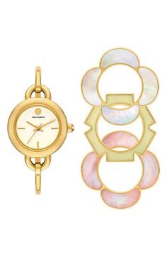 Stacked double-T logos punctuate a slender bangle watch that can be taken up a notch with three interchangeable, flower-shaped top rings in an array of shapes and colors. 27mm case; 5mm band width Includes watch and three interchangeable top rings Quartz movement Mineral crystal face Stainless steel with goldtone plate/mother-of-pearl/epoxy Imported Zodiac Watches, Womens Designer Watches, Watch Set, Bangle Watches, Watch Gift, Top Rings, Stainless Steel Bangles, Sneaker Dress Shoes, Bracelet Ideas