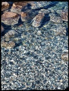 some rocks and water on the ground