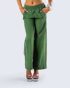 Even though it’s not a race, you’ll still take first place in these green track pants 😜 Perfect for dressing up or down, these pants are made from high quality ripstop fabric and complete with a relaxed fit, double piping on both sides, and side pockets 💚 Green Stretch Parachute Pants With Elastic Waistband, Green Pants With Side Pockets, Green Stretch Cargo Pants, Green Stretch Straight Cargo Pants, Green Wide Leg Parachute Pants Sporty Style, Green Stretch Parachute Pants, Green Baggy Sports Pants, Green Cargo Pants With Elastic Waistband For Loungewear, Green Sports Bottoms Long Pants