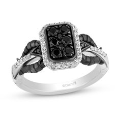 a black and white ring with diamonds on it's shants, set in 18k white gold