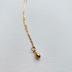 Solid 9ct Yellow Dainty Teardrop Pendant Necklace - handmade - Bohemian style necklace Beautifully simple teardrop pendant on a diamond cut solid gold necklace. This piece is handcrafted and finished in my studio. Pendant - Made with solid 9ct gold, approximately 7mm diameter polished finish. Brushed finish also available. Necklace - Made in solid 9ct gold diamond cut necklace (polished) There are two chain options Both finished necklaces shown are solid 9ct gold: The necklace shown in the first Gold Drop Necklaces In 14k Gold, Dainty Yellow Gold Drop Necklace For Everyday, Classic Teardrop Drop Necklace Gift, 14k Gold Teardrop Necklace With Delicate Chain, Dainty 14k Gold Teardrop Pendant Necklace, Dainty Yellow Gold Drop Necklace As Gift, Minimalist Briolette Drop Necklace For Gift, Minimalist Drop Necklace For Gift, Gold Sterling Silver Teardrop Pendant Necklace