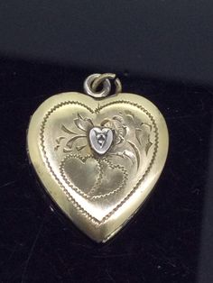 Vintage Heart locket fully hallmarked 12K over Silver in 2 colours Embossed in good condition the back presents discolouration on the plating so please check photographs carefully. If what you want is genuine antiquities and vintage items you must be advised that items have signs of age. Measurements are 2.7cm x 2cm All pieces are unique I aim to provide you with a 5 star service and customer satisfaction is my priority. You can purchase with confidence we are here to assist you. All my items are vintage and pre owned so at times they will have signs of age but I try my very best to describe them with accuracy. Your purchase will be carefully packed to protect it. If you wish it wrapped as a gift for someone then do let me know please. Vintage Heart Locket, Silver Brooch Pin, Travel Box, Enamel Brooch, Vintage Heart, Unusual Design, Silver Brooch, Heart Locket, Beautiful Heart