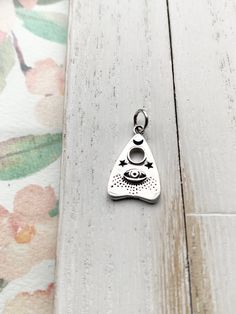 This listing is for (1) Ouija Charm with Evil Eye and Design Pendant 20x11mm including closed bail. sterling silver Nickel Free Sterling Silver Pendant Charm Necklace, Spiritual Sterling Silver Nickel-free Charm Necklace, Spiritual Sterling Silver Nickel Free Charm Necklace, Handmade Spiritual Silver Charms, Nickel Free Symbolic Sterling Silver Charm Necklace, Silver Round Pendant Spiritual Charm, Sterling Silver Teardrop Charms Jewelry, Handmade Sterling Silver Dangle Charm Necklaces, Handmade Sterling Silver Dangle Charm Necklace