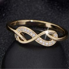 a gold ring with diamonds on it