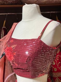 Wine red A line lehenga with digital Floral print and highlighted in big sequence and thread concept work teamed up with similarly silk spaghetti strap blouse. Completed look with contrasting peach one sided organza designer ruffles dupatta. Size: 38 Ready to Ship! Sleeveless Organza Sharara For Party, Art Silk Sleeveless Sharara For Party, Party Art Silk Sharara, Red Sleeveless Lehenga For Party, Sleeveless Red Lehenga For Party, Red Sleeveless Party Lehenga, Red Sequined Georgette Lehenga, Red Georgette Lehenga With Sequins, Red Sharara With Mirror Work For Party