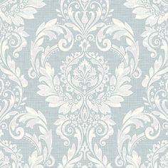 a blue and white wallpaper with an ornate design