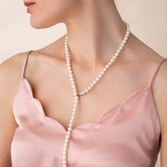 The Adjustable Pearl Lariat Necklace is approximately 27 inches in length with beautifully graduated freshwater pearl gemstones. The pearls are 7mm with the end steadily increasing to larger 10mm pearls. The sterling silver clasp allows you to adjust the graduated strand to a length unique to you. The strand can also be worn down the back to accent that backless dress or as a perfect bridal ensemble. Luxury Dainty Single Strand Pearl Necklace, Elegant Pearl Necklace With Pendant, Elegant Long Pearl Pendant Necklace, Elegant Long Lariat Necklace For Formal Occasions, Elegant Pearl White Backdrop Necklace With Pearl Drop, Adjustable Pearl White Lariat Necklace, Adjustable Lariat Pearl White Necklace, Elegant Pearl White Lariat Jewelry, Elegant Pearl Backdrop Necklace With Pearl Drop