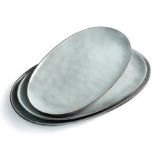 three silver plates stacked on top of each other