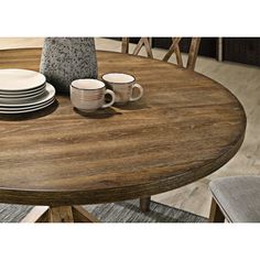 This type of base is known for its crossed wooden supports, which are reminiscent of antique barn doors. It provides a sturdy foundation for the table while adding a rustic charm to its design. his would suggest that the table is of a size that allows for intimate meals with family or close friends. Perfect for small gatherings or everyday meals, it offers enough space to dine comfortably while maintaining a cozy atmosphere. This combination of a cross-buck pedestal base with a seating capacity for four people makes this table a versatile choice. Whether it's a family meal, a dinner party with friends, or even a place for your morning coffee, this table can accommodate your needs while adding character to your dining space. Enjoy the blend of functionality and style that this table brings! Circle Dining Table, Black Round Dining Table, Wooden Kitchen Table, Round Dining Room Sets, Round Dining Room Table, Round Dining Table Sets, Round Dining Room, Counter Height Dining Table, Trestle Dining Tables