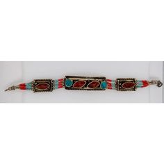 This beautiful, one-of-a-kind piece of jewelry, made around the 1920s in the Atlas Mountains of Morocco, features genuine turquoise and red tear-shaped stones. The impressive craftsmanship and design speak volumes about the rich culture of Morocco. The bracelet has been cleaned and is in great condition.  Size: 7.5" L x 0.5" W Artisan Red Jewelry With Inlay, Artisan Red Inlay Jewelry, Red Traditional Bracelets For Festival, Traditional Red Bracelets For Festivals, Red Gemstone Beaded Bracelet Bohemian Style, Ceremonial Red Gemstone Jewelry, Red Vintage Bracelets For Festivals, Vintage Red Bracelets For Festival, Red Bohemian Beaded Gemstone Bracelet