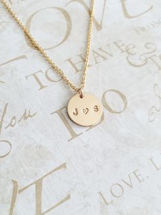 "Couples Initial Necklace - 14K Gold Filled - Mothers Gift - Name Necklace - Initial Necklace - Personalized Necklace - Gift for Her - 11mm * Dimensions: 11mm Diameter 14K Gold Filled Circle Disc Pendant * Necklace Chain Length: Available in 14in, 16in, or 18in ---------------------------------- HOW TO ORDER 1. Select the length that you would like from the drop down menu. * This item only comes in Font Type 3 (1.5mm)* This listing is for (1) necklace. Please feel free to let us know if you have 14k Gold Round Pendant Charm Necklaces For Wedding, 14k Gold Round Pendant Charm Necklace For Wedding, 14k Gold Charm Necklace For Anniversary, 14k Gold Necklace For Valentine's Day, Dainty Stamped Yellow Gold Jewelry, Gold Hand Stamped Charm Necklaces For Wedding, 14k Stamped Jewelry For Valentine's Anniversary, Stamped 14k Gold Necklace For Anniversary, Dainty Hand Stamped Necklaces For Anniversary