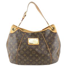 Business Shoulder Bag In Monogram Canvas With Handle Drop, Business Shoulder Bag With Handle Drop In Monogram Canvas, Business Monogram Canvas Bags, Business Shoulder Bag With Gold-tone Hardware And Coated Canvas, Classic Monogram Canvas Bag With Branded Hardware, Classic Formal Shoulder Bag With Logo, Classic Gold Shoulder Bag With Logo, Classic Gold Monogram Canvas Shoulder Bag, Formal Double Handle Shoulder Bag With Logo