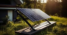 a solar panel sitting on top of a wooden bench in the middle of a field