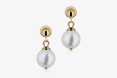 Crafted to perfection, the Lana Pearl Earring features a lustrous freshwater pearl and light gold hardware, in a subtle yet striking design. Whether you're attending a special occasion or simply want to enhance your everyday style, the Lana Pearl Earrings are a statement of grace and refinement. Classic Single Pearl White Earring, Classic Pearl Chain Earrings, Classic Round Pearl Chain Earrings, Evening Akoya Pearl Drop Earrings, Modern White Akoya Pearl Earrings, Timeless Pearl White Earrings With Pearl Charm, Elegant Pearl White Earrings With Pearl Charm, Modern White Pearl Earrings For Formal Occasions, Modern Pearl Earrings For Anniversary