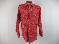 "Vintage 1960s bandana print cowboy western shirt. Made of red and white poly/cotton. Has a snap front, pearlized snaps, chest pockets, and snap cuffs. Made by Trumpeter. Size large. Actual measurements are: 47\" at the chest 45\" at the waist 18\" shoulder seam to shoulder seam 24\" shoulder seam to cuff 32.5\" overall length In very good condition." Red Western Style Tops For Ranch, Vintage Long Sleeve Shirt For Western-themed Events, Vintage Red Tops For Rodeo, Bandana Shirt, White Polka Dot Shirt, Cowboy Shirt, Cowboys Shirt, Polka Dot Shirt, Cowboy Western