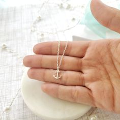 "Beautiful handmade anchor necklace in 925 sterling silver. This delicate necklace is perfect as a gift for a special woman, Christmas gift, beach wedding, bridesmaid, birthday or her special day. ♥ Details: Metal type: Sterling silver Karat / purity: 925 Anchor dimensions: 9.7 x 8.1mm Chain length: 14\", 16\", 18\", 20\". The necklace is 100% handmade. Each necklace takes approximately 2 hours to be ready, so you are buying a piece that was made with love and dedication. All jewelry comes with Everyday Silver Anchor Jewelry, Everyday Silver Jewelry With Anchor Shape, Minimalist Sterling Silver Jewelry For Beach, Nautical Sterling Silver Necklace For Gift, Nautical Sterling Silver Necklace Gift, Nautical Sterling Silver Necklace As Gift, Adjustable Anchor-shaped Necklace For Gifts, Nautical Style Adjustable Jewelry Gift, Ocean-inspired Adjustable Charm Necklace Gift