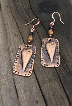 Unique copper heart earrings with Garnet and picture jasper gemstones. You will love these antique copper steam punk heart earrings! Garnet is the stone of love, and it is the perfect complement to the picture jasper stone. These earrings are 2 inches long and 5/8 of an inch wide. They are slightly heavier than most of my other earrings, but not too heavy. Weight is 3.8 grams. The French ear wires are solid copper. All my jewelry comes gift boxed with a custom Shelly Mariposa Design butterfly ca Garnet Heart, Design Butterfly, Copper Heart, Dragonfly Jewelry, Jewelry Heart, Dragonfly Pendant, Jewelry Picture, Garnet Earrings, Picture Jasper