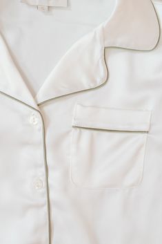 a white shirt with two pockets on it