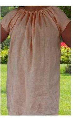 the back of a woman's dress in tan linen