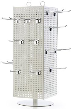 a metal rack with six hooks and four holes on the front, one is white