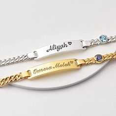 Make lasting memories with this beautiful baby bracelet, the perfect gift for a new born or a new mom. Featuring an engraved name and a genuine birthstone, this timeless bracelet is a perfect way to commemorate any special occasion. An elegant and tasteful gift idea that can be enjoyed for years to come. Please send us in the request box above: Put your personalization details, preferred ICON & FONT, and Birthstone hereEg: Alice + Icon 2 + Font 1 • Word limits: 8 characters/side • Default font is font 5 • Please measure the baby's wrist. Age guide is based on average size only. P R O D U C T • I N F O ✅ MATERIAL: High Quality Solid 925 Sterling Silver with 18K Gold, Rose Gold-Plated. ✅ DIMENSION: The plate charm measures approx. 1 1/4" (32mm) in length and 1/4" (6.5mm) in width. ✅ BRACELET Silver Baby Bracelet, Timeless Bracelet, Toddler Bracelet, Kids Bracelets, Baby Bracelet, Gold Name Necklace, Bespoke Gifts, Mother Birthday Gifts, Monogram Necklace